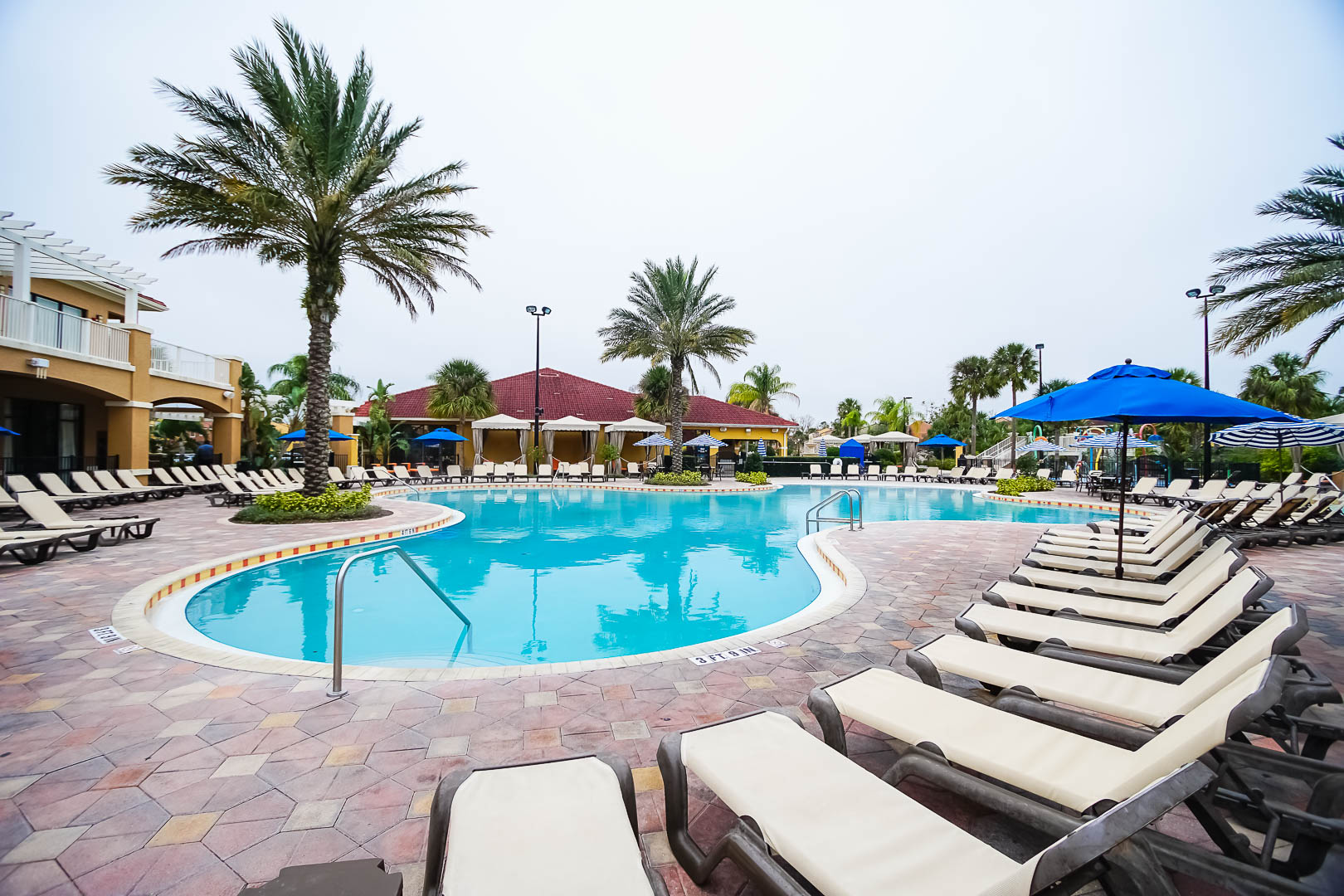 An expansive outdoor swimming pool at VRI's Fantasy World Resort in Florida.